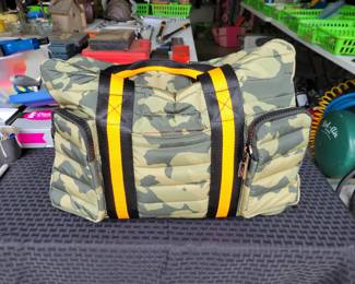 Woman's Handbags THINK ROYLN - The Highlander Duffel Bag w/ Trolly Sleeve- this bag is loaded with pockets and plenty of storage done in camo military green and bright orange/black accents. Description
Travel plans? If not, you'll definitely want to make them once you get your hands on this fab bag. With a convenient trolley sleeve and plenty of exterior pockets (and interior space!) this duffel bag keeps you organized (and looking so cute paired with your airport athleisure 'fit!). From Think Royln.
Style: The Highlander
Reversible strap, trolley sleeve, top zip entry, four zip pockets
Lined interior, zip pocket
Measures approximately 16" x 12.75" with a 52" strap; weighs 2.17 lbs
Shell 100% nylon; lining 100% polyesterOUR PRICE $40.00(list $99-$258 on ebay)