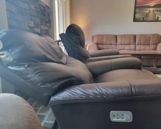 STATE OF THE ART -- TWO LA-Z-BOY ROCKING POWER LEATHER RECLINERS WITH POWER HEADREST AND BACK INFLATING SUPPORT AND ELECTRONIC CHARGING FOR YOUR PHONE/TABLET - $250 EACH