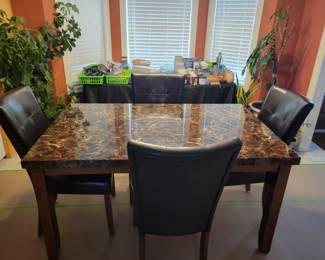 DINING TABLE AND FOUR CHAIRS $100