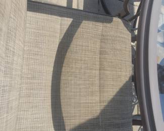 QUALITY GREAT CONDITION HAMPTON BAY ROUND GLASS TOP PATIO TABLE WITH FOUR ARMMED SWIVEL CHAIRS $150......UMBRELLA AND BASE PRICED SEPARATELY @$50- TOTAL $200 FOR PATIO SET WITH UMBRELLA AND BASE