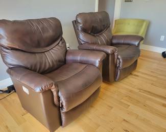 STATE OF THE ART -- TWO LA-Z-BOY ROCKING POWER LEATHER RECLINERS WITH POWER HEADREST AND BACK INFLATING SUPPORT AND ELECTRONIC CHARGING FOR YOUR PHONE/TABLET - $250 EACH