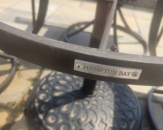 QUALITY GREAT CONDITION HAMPTON BAY ROUND GLASS TOP PATIO TABLE WITH FOUR ARMMED SWIVEL CHAIRS $150......UMBRELLA AND BASE PRICED SEPARATELY @$50- TOTAL $200 FOR PATIO SET WITH UMBRELLA AND BASE