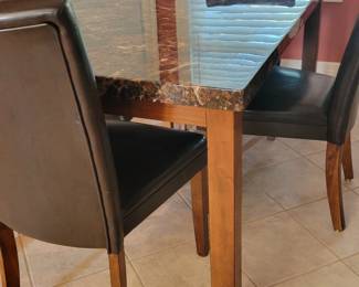 DINING TABLE AND FOUR CHAIRS $100