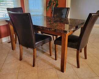 DINING TABLE AND FOUR CHAIRS $100