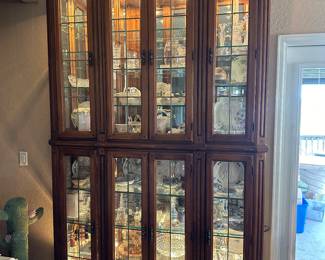 Huge Beveled Glass Lighted Mirror back Display Cabinet.   Filled with  cut glass and crystal, lattice porcelain,  Collector plates, Haviland, Waterford, Wedgewood