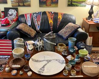 Studio pottery, vintage pennants, leather loveseat