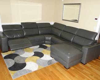 Macy's Leather sectional in 5 pieces, backs move forward and back, recliner Originally cost $6,000.