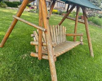 Log cabin style swing. $140 buy it right now price. . Excellent .