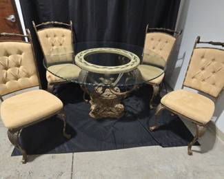 Beautiful Table With Heavy Glass Top And Decorative Base And Four Matching Chairs