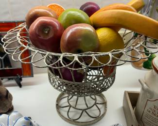 Metal basket of faux fruit
