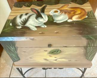 Painted rabbit trunk on metal stand