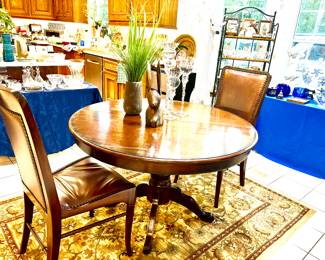 Round to oval breakfast/dining table and 2 chairs