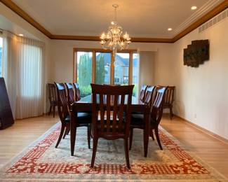 Bernhardt Furniture “Paris Collection’’. Table with two leafs plus protective pads, total of 10 chairs, eight side chairs and two armchairs.