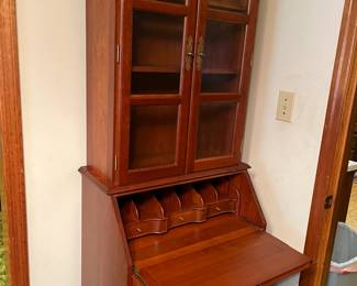 #51 Secretary w/2 glass doors w/2 wood Shelves 4 drawers w/flip-down desk w/cubbies 27x17-26.5x77 $275.00