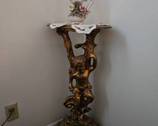 Gilded cherub stand