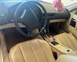 1994 Mercedes SL500 Two-Door Convertible! Asking $25,000!! 30,000 original miles, red matching removable hard top, perfect black soft top, immaculate tan interior