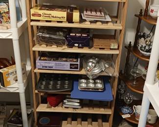 Baking pans, cook books , antique corner cabinet. rugs.