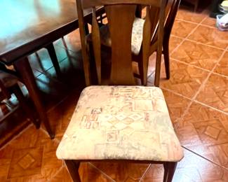 One of the MCM chairs that goes with the table. If you choose, they are easy to recover.