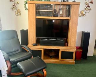Picture here are an electric reclining massage chair, and an entertainment unit with all kinds of electronic equipment.