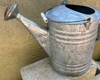 Galvanized metal watering can