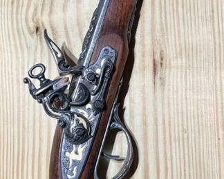 Vintage wood flintlock pistol with porcelain details