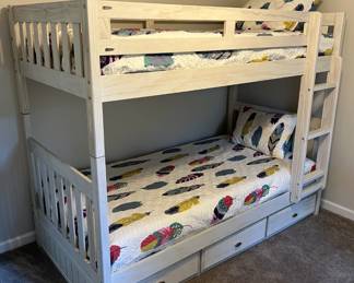 White-washed twin bunk beds with drawers