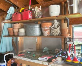 Red gas cans and flower pots