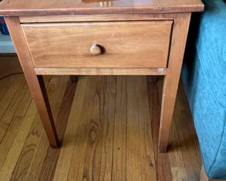 One of a pair of single drawer end table early american style