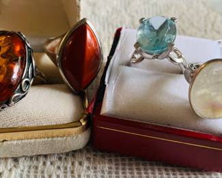 Amber and silver ring along with other silver and stone rings