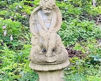 Concrete cherub fountain