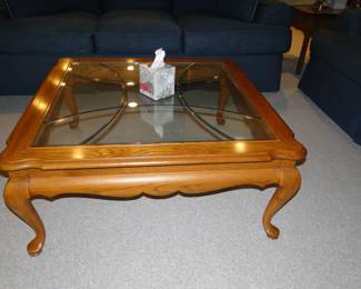 Glass topped solid wood coffee table with great detailing