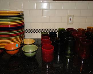 All the colorful drinking glasses that you need, and matching bowls