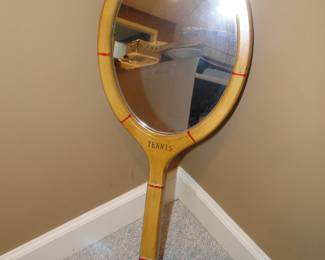 Yes, it is a tennis racket mirror