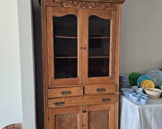 Oak cabinet. C.1900.  Original hardware.  Carving is applied.  