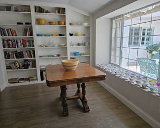 American Empire style oak trestle style extension table.        C. 1900.