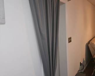 Thermal, black out drapes.  located off the wall now in the downstairs area