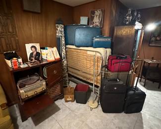 Beatles Autograph Picture Book; 45 Records; Cassettes & CD’s; Exhibit Cards w/ Billboard Biography; Beatles 20 Wallet Photos; Admiral Record Player/ TV; Hideaway Bed; Vintage luggage; Area Rug; MCM Towel Rack; Shoe Shine Box