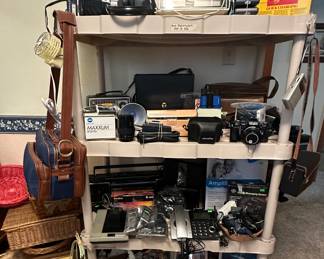 Baskets; Sony Boomboxes; Transister Radios; Eveready Battery Charger; Uniden Bandit SS Radar Detector; Minolta 7000 Camera; Minolta H-Matic E; Kodak Insta Matic X-15; Canon Power Shot A540 Camera; Minolta Maxim AF35-70/4 Lens; Polaroid Portrait Kit 581A; GE M3 Flashbulbs; Camera Bags; Pictures; Cordless phones; Eads-Phone; Aida Boombox; GE Digital Messaging System; AT&T Trillin Phone 230; GeeMarc Ampli 550/ 500+ Phone; Pictures