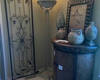 Metal Wall Panel, Torchere Floor Lamp, Rounded Wood Cabinet