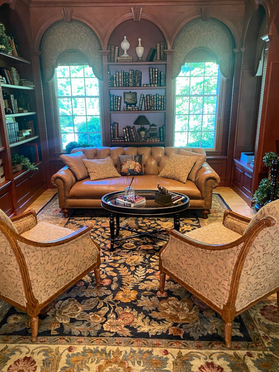 Great rug and chesterfield sofa