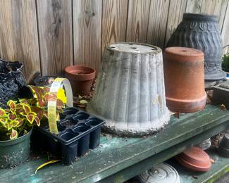 Large selection of flower pots, garden tools, planting station