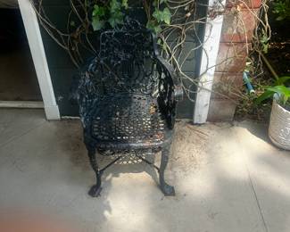 A pair of cast-iron chairs