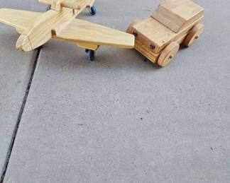 A Rolling Wooden Plane And Car