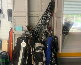 Lots of golf clubs. 