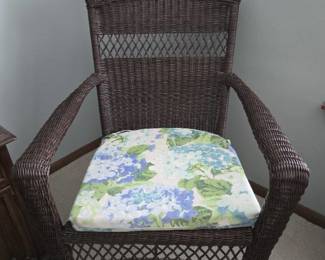 Brown Wicker Chair with Floral Seat Cushion