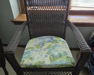 Brown Wicker Chair with Floral Seat Cushion