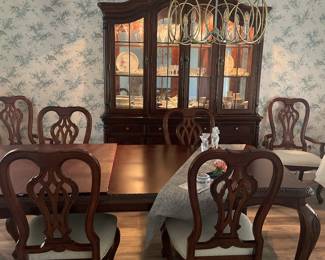 Dining table with pads, 6 chairs, and china cabinet. Great condition