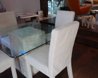 42                   Glass  top  table on  base  with  4  chairs             42"x  42"   Price    is  175.00
