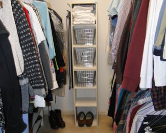 Clothing, both men's and women's, shoes, belts, ties, pants, the closet is packed full