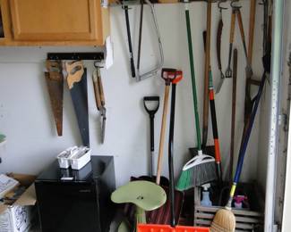 The garage holds all the garden and outdoor tools you will ever need